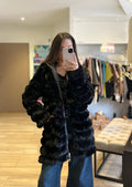 Manteau long noir en fausse fourrure