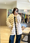 Manteau long beige fausse fourrure